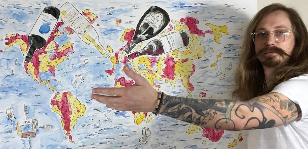 Brandon Lee Wise with his world wine map illustration