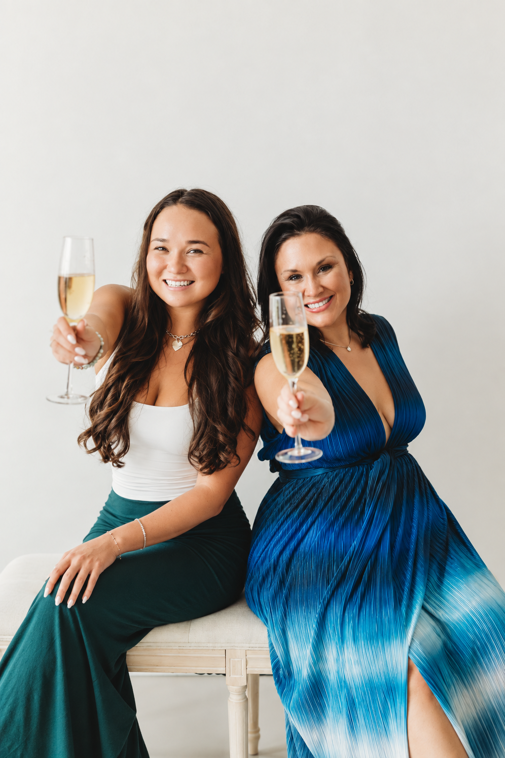 Lauren and Riley toasting with champagne